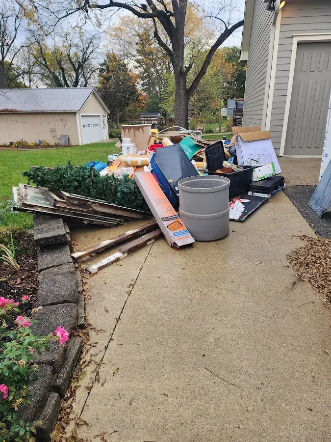 Dumpster being loaded with debris for 3 Yard Dumpster Rental in Combee Settlement